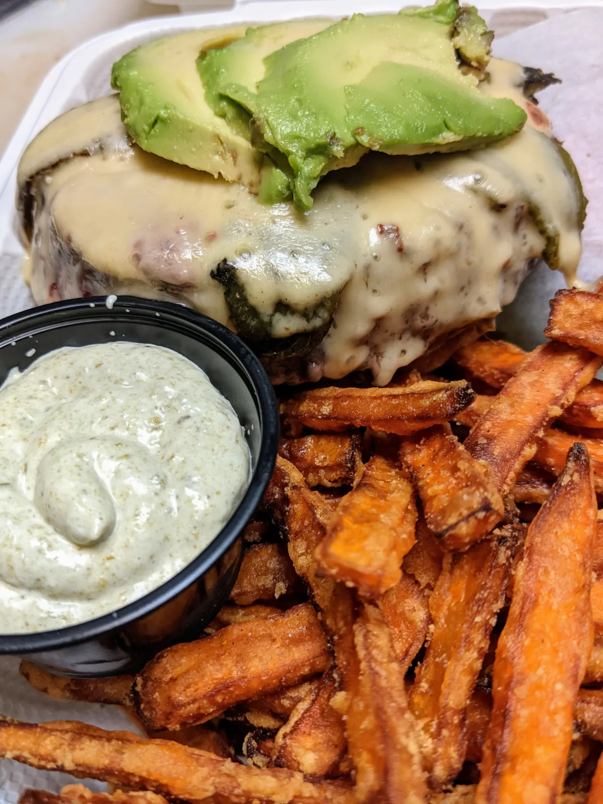 Avocado cheeseburger with sweet potato fries