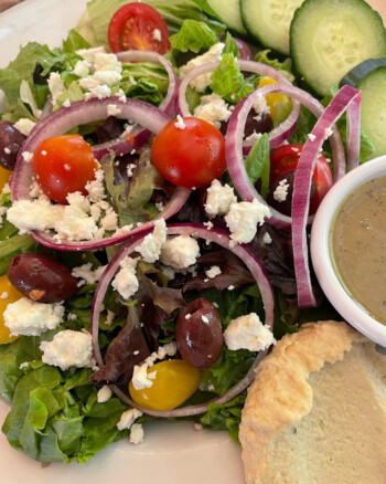 Greek salad with tomatoes, olives, cucumbers, and feta