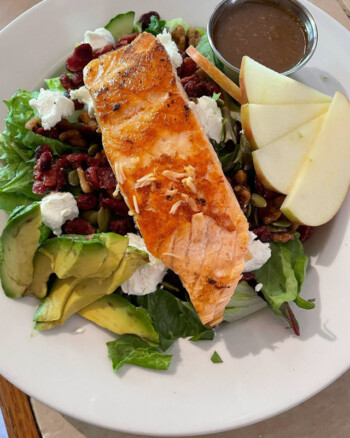 Grilled salmon salad with greens and avocado