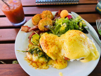 Eggs Benedict breakfast with fresh fruit