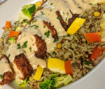 Grilled chicken grain bowl with vegetables