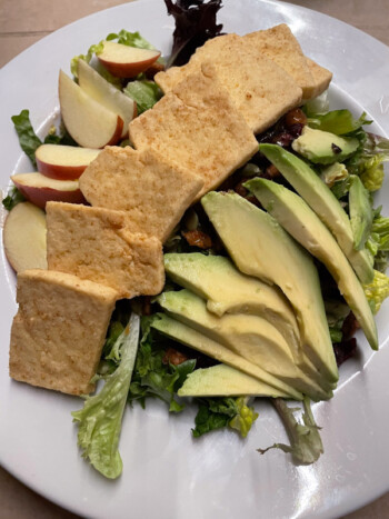 Hummus plate with vegetables and pita