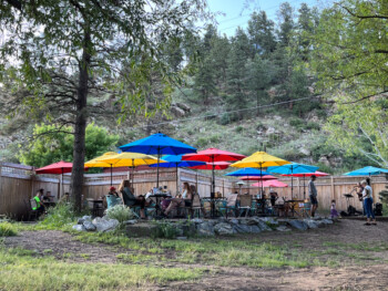 Colorful umbrellas on Blackbird Cafe's creekside patio