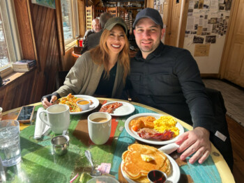Guests sharing breakfast and coffee at Blackbird Cafe