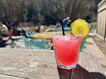 Prickly pear cocktail served on the creekside patio